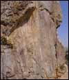 The main group of images pecked into a natural rock face. Each of the figures has horns and a tail apparently representing devils of Byzantine date rather than early prehistoric depictions of animals. The largest image, at the top with horns partly in shadow, is shown in detail on the previous image. No other remains were seen in the immediate vicinity.